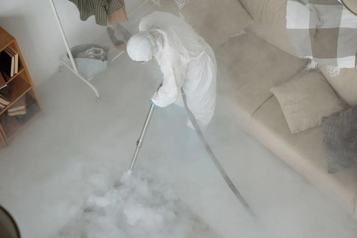 Biohazard cleanup technician in protective equipment, Colfax, WA